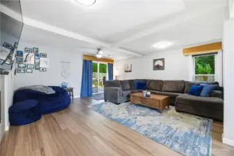 Living room with slider to Trex Deck and fully fenced yard