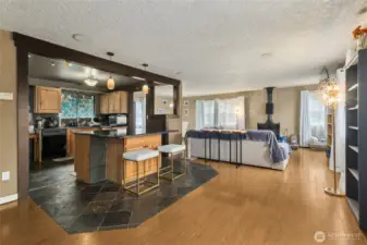 A connected living space where the kitchen, nook, dining room, and living room flow together with ease—ideal for gathering, entertaining, and comfortable day-to-day living.