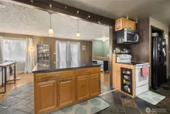 The oversized central island doubles as a breakfast bar - perfect for casual meals and conversation.