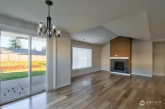 Large living room with fireplace and plenty of natural light