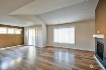 Light filled dining area with glass slider leading to back yard.