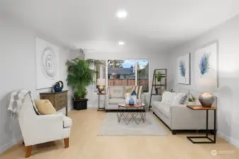 Beautiful new flooring and windows make this living room perfect for every day living and entertaining!