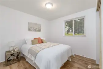 Second bedroom across from the primary and separated by the main bath.