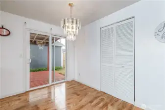 Dining space off the kitchen with storage behind those louvered doors.