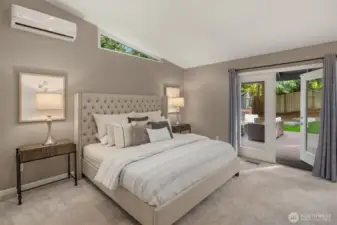 Primary bedroom - French doors lead to large Trex deck
