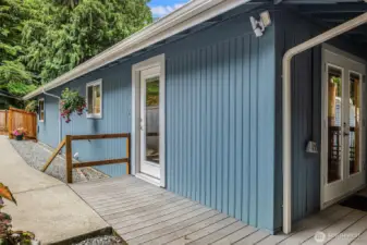 Deck to back length of home leading out to side garden