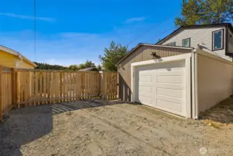 Off the alley is parking plus a garage