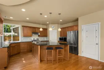 Don't miss the gorgeous hardwood floors! The perfect kitchen for the chef in the house! With loads of counter space, cabinet space, walk-in pantry and quality finishes.