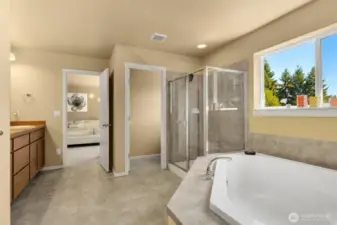 5-piece bath with tile countertop and soaker tub.