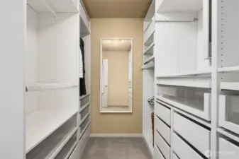 Check out this amazing custom closet!! There is so much great storage here right off the primary bathroom!
