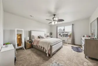 Spacious primary bedroom with walk-in closet and full bath