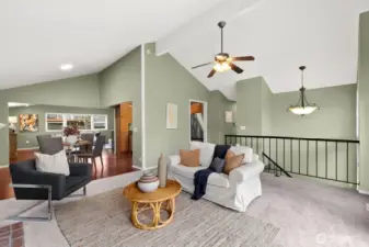 View looking back to dining area, kitchen & hall to bedrooms.