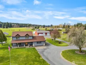 Welcome to this peaceful multi-generational home on acreage with shop.