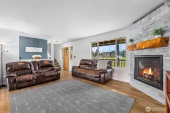 Another view of this gorgeous fireplace. Imagine how cozy this room is on a cold winter day. On the warmer days this home has AC.