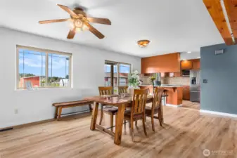 Dining area is big enough that it could be split into more family room and still have plenty of room for dining room table. Home has several ceiling fans for efficiency .