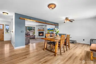 Another view of dining area. The wood above the dining room entrance is a shelf for pictures, objects, or memorabilia.
