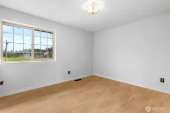 Upstairs bedroom number two with view of front yard.