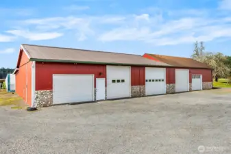 The shop- 200 amp main service. One 100 amp sub panel. Two 50 amp sub panels. Six 30 amp 220 plugs.12 foot eaves. Six inch concrete. Anchor points in slab. Six roll up doors. Four man doors. Ben pak 10,000 pound car/truck hoist.4 ton HVAC unit with spiral ductwork.Bathroom.Utility sink. Hot water.Small refrigerator.Office area.Fiberhigh speed internet. 4 power cord reels. One airhose reel. RV power plug. 110 plugs everywhere. Large attic space with plywood floor and an alarm system!