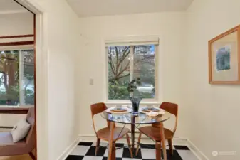 Sunny dining area, offering pleasant neighborhood views