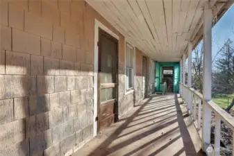 Covered Front Porch overlooks the large acre parcel
