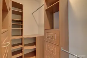 Primary walk-in closet with custom built-ins.