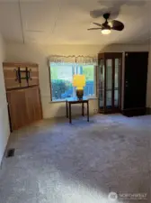 Living Room has Vaulted Ceiling with Fan