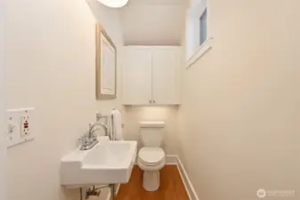 Powder room on main level off of kitchen.