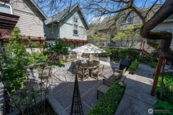 The community courtyard is a true garden oasis-great for relaxing, enjoying quiet moments outdoors, and bar-b-ques with friends and neighbors.