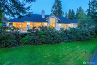 Expansive deck is perfectly positioned along the entire back side of the house and above the 15th green.