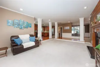 Oversized family room offers a double-sided gas fireplace.