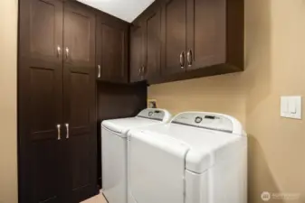 laundry room with beautiful custom cabinetry for built-in storage