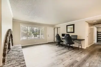 A large window in the living room lets in the natural light.