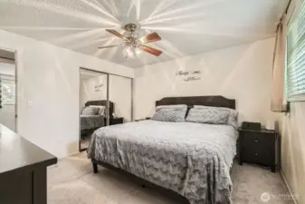 Another view of the primary bedroom which features a private bath.