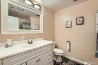 Full bath with tub/shower combo.