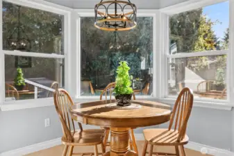 Dine in this kitchen with its natural light of these quaint bay windows
