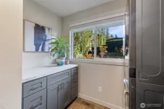 Laundry room folding table and storage