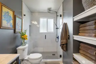 Primary bath walk-in shower with full height tile