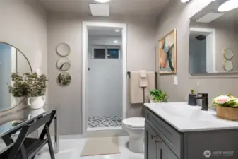 Additional laundry hookups behind makeup vanity provide flexibility for making this a 2nd laundry/bath if desired