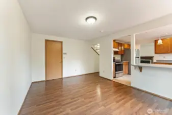 Versatile dining or family room space with durable laminate flooring and an open flow into the kitchen. A perfect multi-use area for meals,  and gatherings