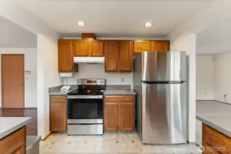 Updated kitchen featuring stainless steel appliances, abundant cabinet storage, and a practical layout for everyday cooking.