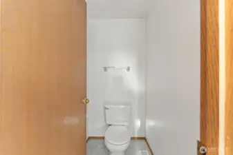 Convenient main-floor half bath with a simple and functional layout, perfect for guests.