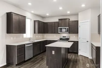 Electric range and counter top space. Pictures are for representational purposes only, colors and features may vary.