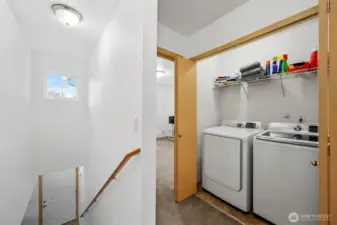 Upstairs laundry adds convenience. Laundry is set between the guest bedrooms.