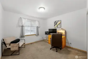 Guest room #1 looks out the front of the home.