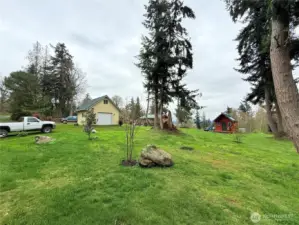 View of property, potential future home site is where the red shed sits now.