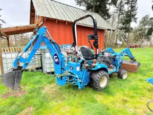2022 LS Tractor with front loader & backhoe, has less than 100 hours