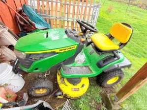 John Deere riding lawn mower. Less than 50 hours on it