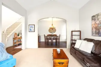 Arched doorways open to formal dining room