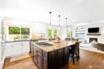 A kitchen you will love! Granite oversized island, built in gas cooktop w/ downdraft