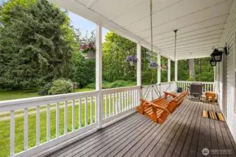 Sip your morning coffee on the covered porch admiring the natural beauty of the property.